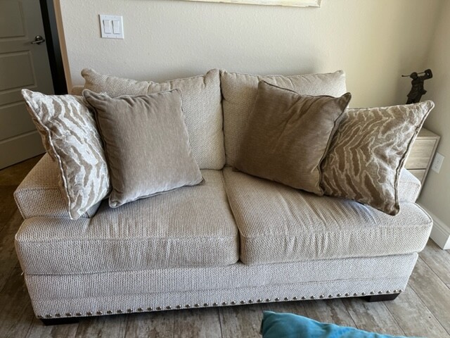 1 YEAR OLD COMFY LOVESEAT WITH OTTOMAN AND PILLOWS