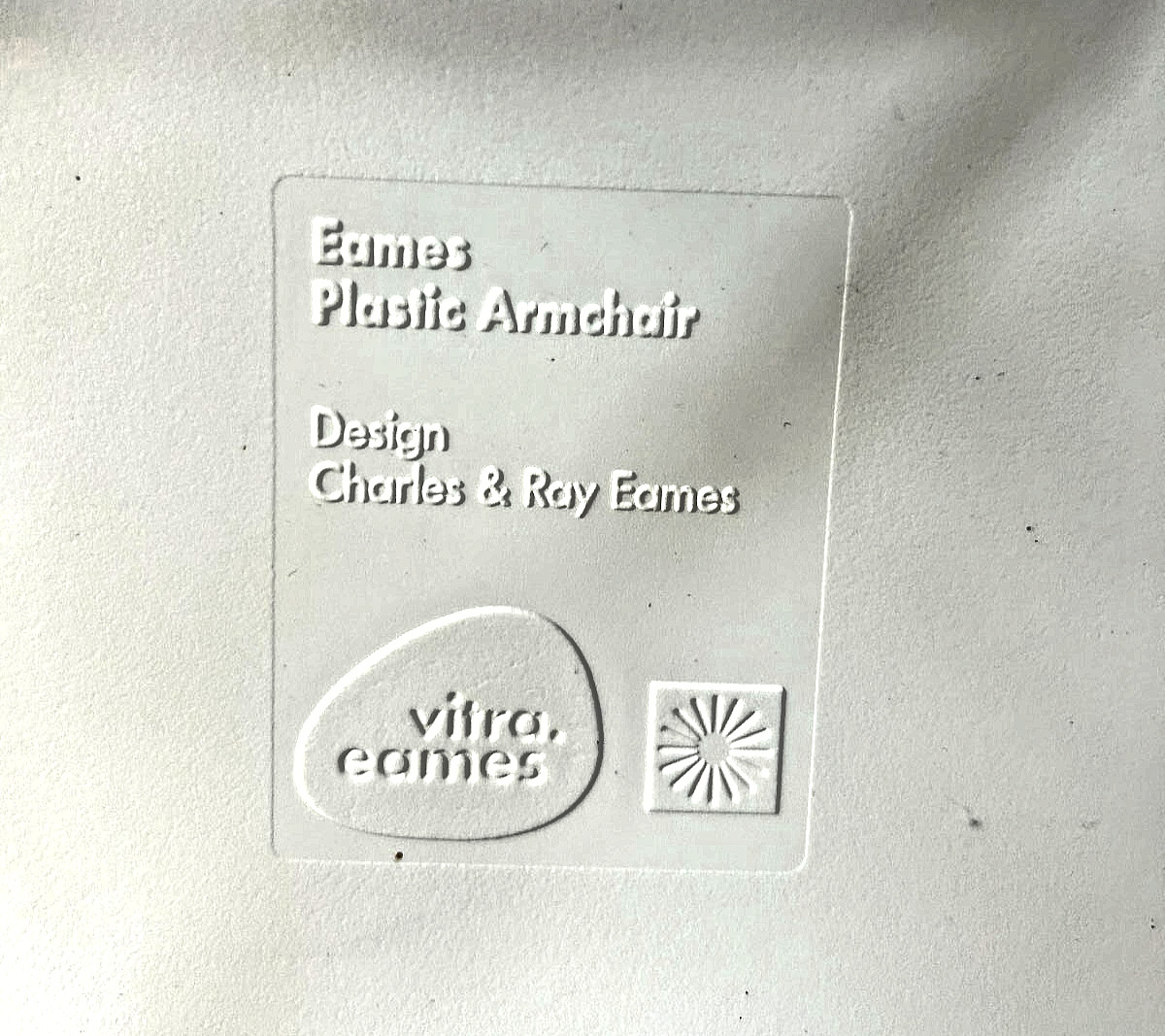 Pair of Eames molded plastic wire base chairs Made by VITRA